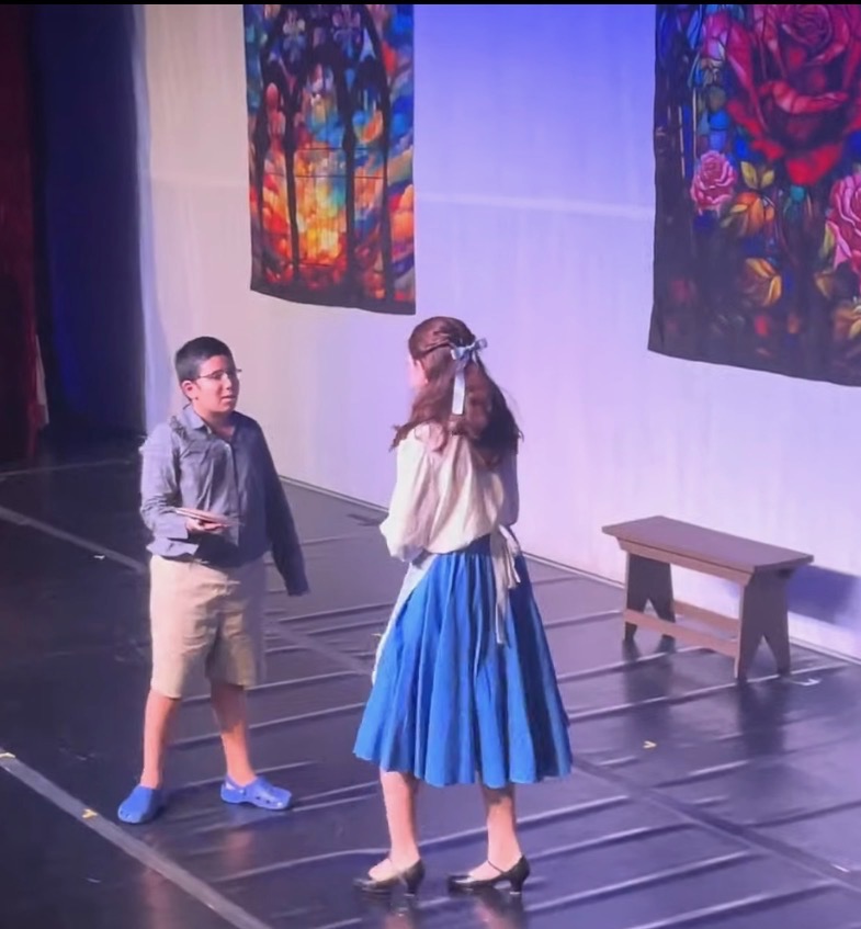 Raiden Fernandes as Narrator 1 and Baker in Beauty and the Beast Jr.